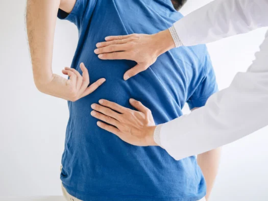 Physiotherapist providing manual therapy to a patient’s back