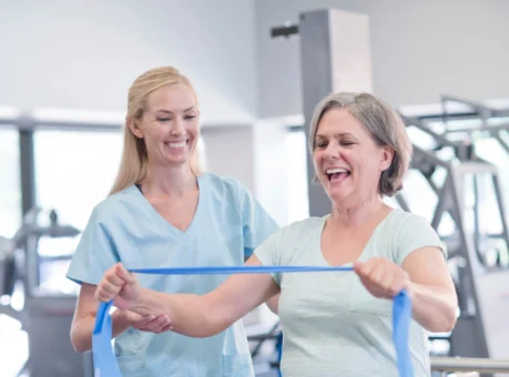 Physiotherapist explaining treatment to a patient in a clinic